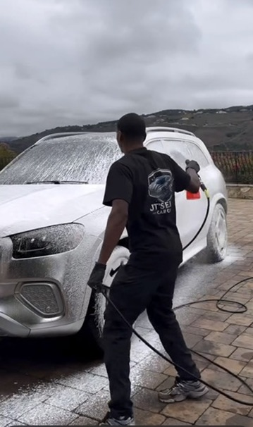 JT detailing an SUV on location